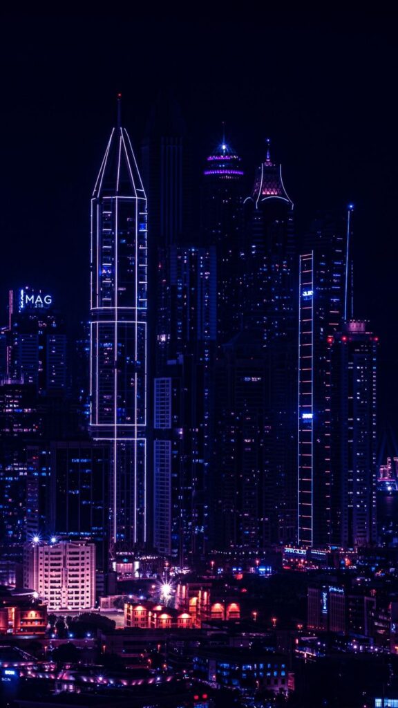 wallpaper para celular onde A cidade ganha vida sob o manto noturno